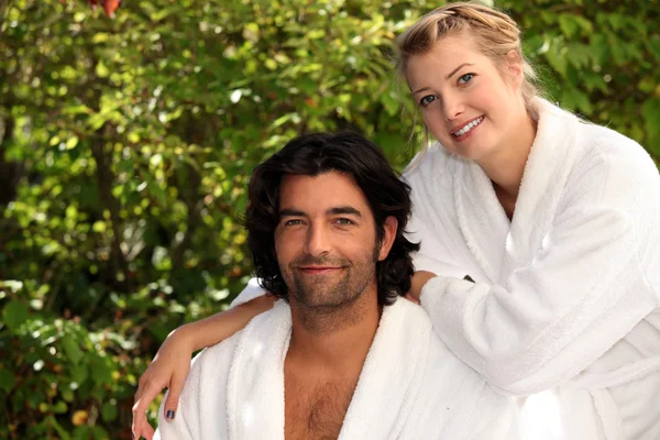 Couple in dressing gowns — Stock Photo, Image