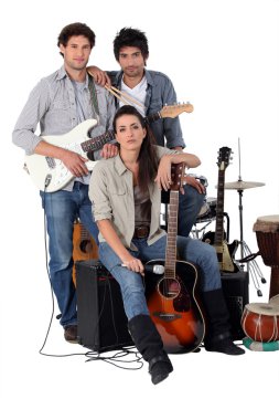 A rock band posing with their instruments clipart