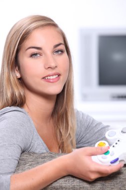 Teenage girl with games controller clipart