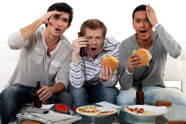 Group of friends watching a football game clipart