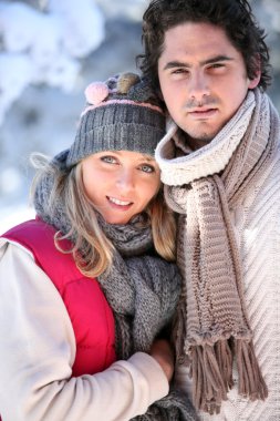 Wintry young couple clipart