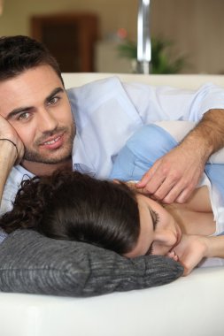 Man caressing his sleeping wife clipart