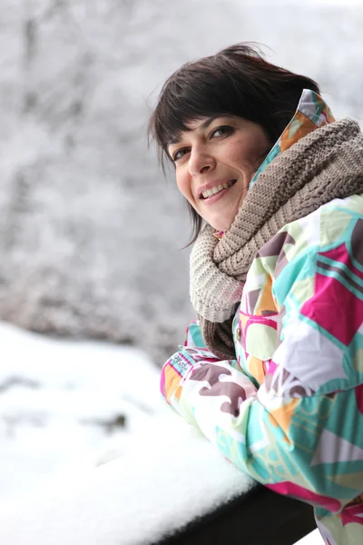 Woman wrapped up in the snow — Stock Photo, Image