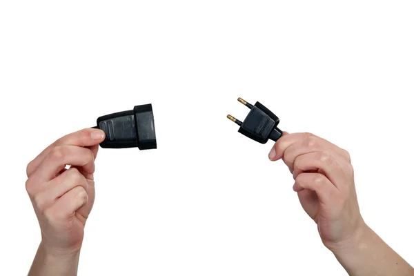 Hands holding two prong plug — Stock Photo, Image