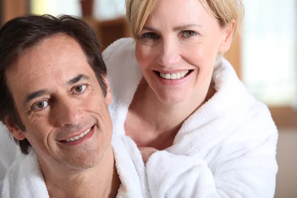 Couple in bath robes — Stock Photo, Image