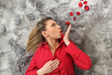 Woman blowing rose petals clipart