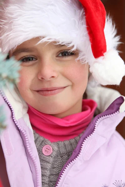 Μικρό κορίτσι φορώντας καπέλο santa — Φωτογραφία Αρχείου