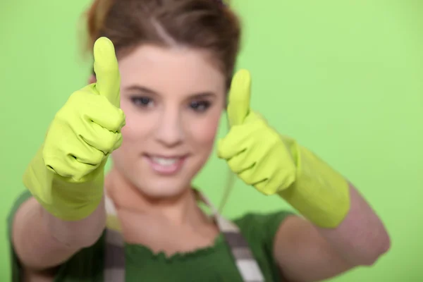 Housewife making a thumbs up sign — Stock Photo, Image