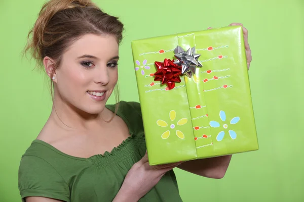 Charming young blonde receiving present — Stock Photo, Image
