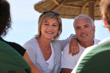 Middle-aged couple staying at resort clipart