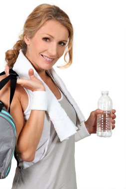 Woman returning from gym clipart