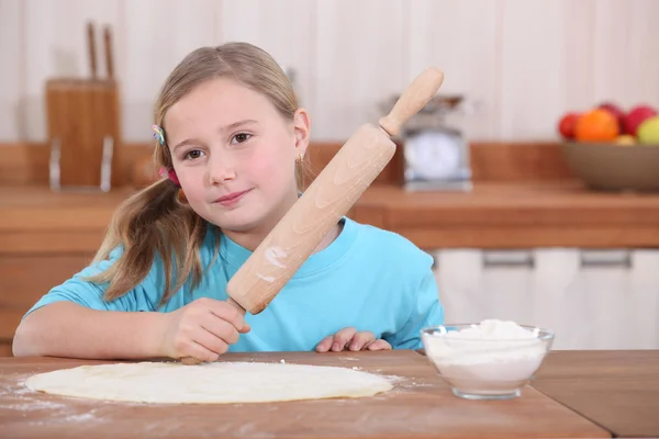 Little girl with rolling pin — Stock Photo, Image