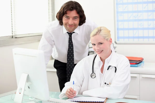 Doctor at a desk — Stock Photo, Image