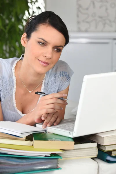 Woman studying from home Stock Photo
