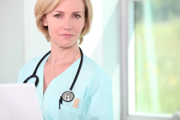 Female doctor with stethoscope Stock Image