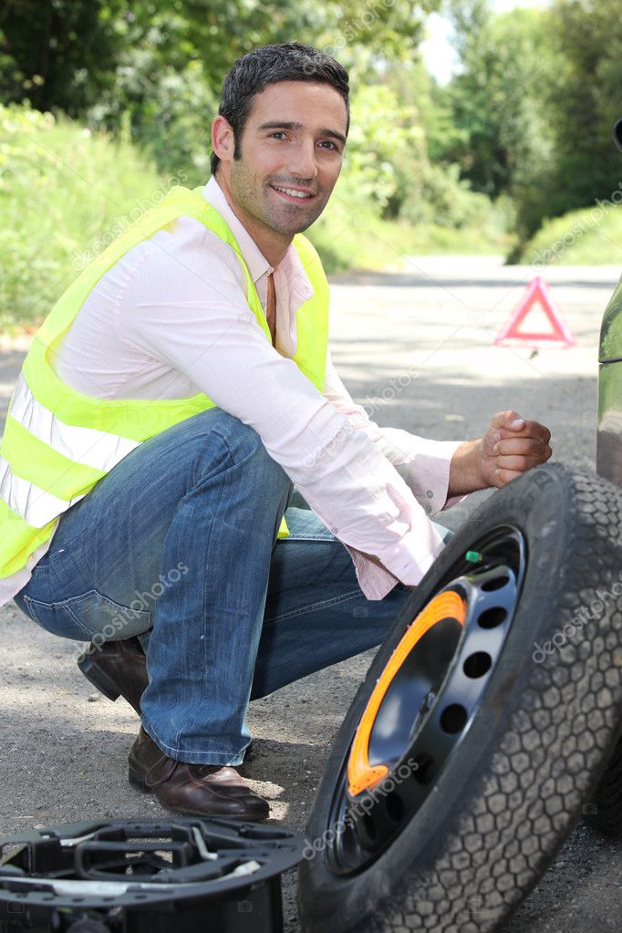 Man Changing A Wheel Stock Photo By Photography