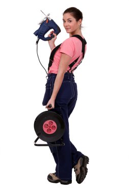 Woman with an electric saw clipart