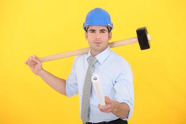 Engineer holding a rolled-up blueprint and a mallet clipart