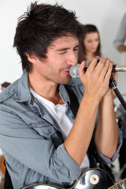 Male vocalist in a rock band clipart
