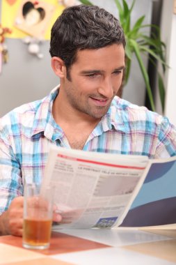 Man reading a magazine clipart