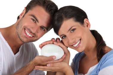 Couple holding bar of soap clipart