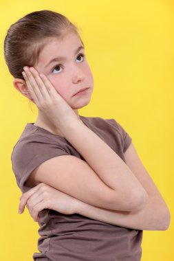 Little girl bored. clipart