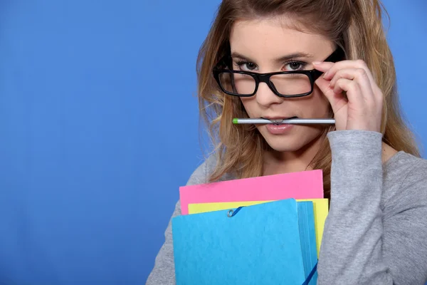 Geeky looking woman with folders — Stock Photo, Image