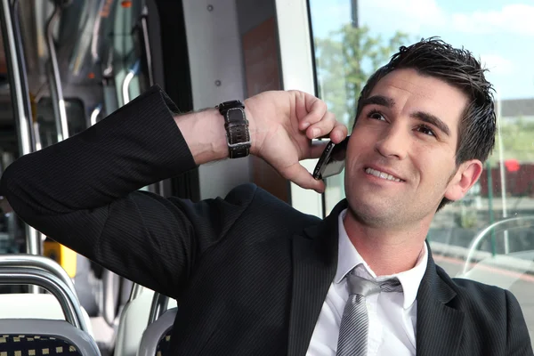 Man on the phone in tramway — Stock Photo, Image