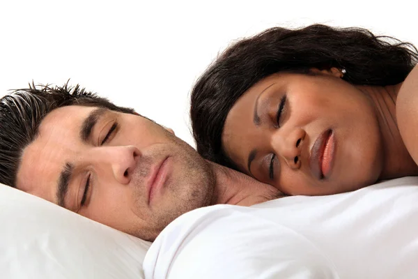 Woman sleeping on her husband's chest — Stock Photo, Image