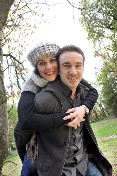 Autumnal couple in the woods — Stock Photo, Image