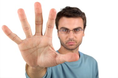 A man opening his hand close to the camera clipart