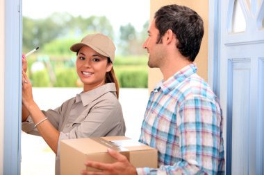 Man receiving package from a delivery girl clipart