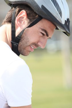 A man wearing a bike helmet clipart