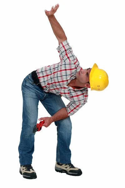 Trabalhador da construção com o braço para cima — Fotografia de Stock