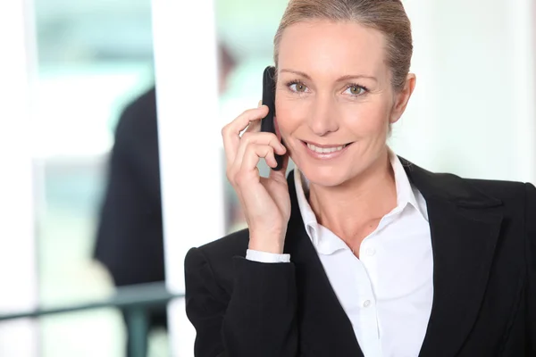Smart woman on a mobile phone — Stock Photo, Image