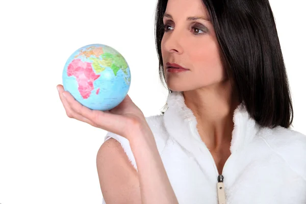Woman holding small globe — Stock Photo, Image