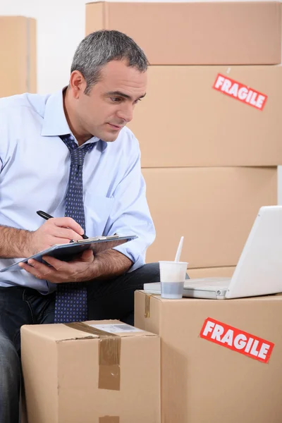 Man searching for new furniture on the internet — Stock Photo, Image