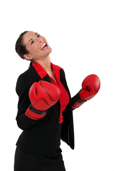 Ecstatic businesswoman with boxing gloves — Stock Photo, Image