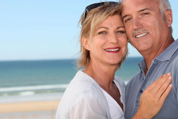 Happy couple at the beach Royalty Free Stock Photos