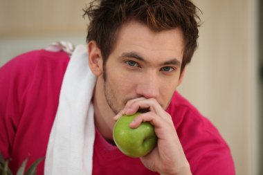 Man about to eat an apple clipart