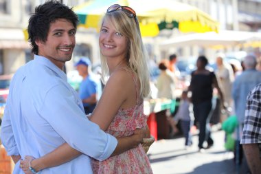 Young couple going to the market clipart