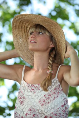 Woman cooling down in the shade clipart