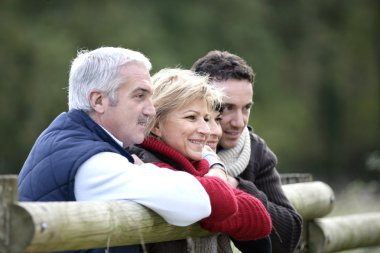 Family strolling outdoors together clipart