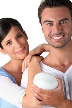 Woman and man holding stone clipart