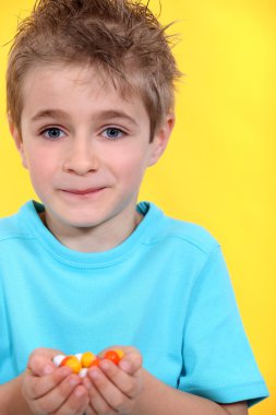 Little boy receiving candies clipart