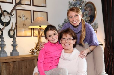 Girl with her mother and grandmother clipart