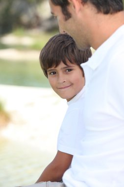 Child and man watching each other clipart