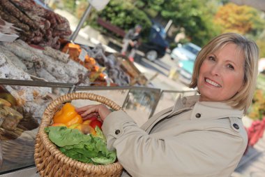 Woman shopping at market clipart