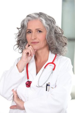 Portrait of mature female doctor clipart