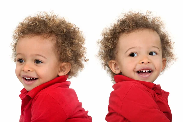 Adorable-looking twins with curly hair — Stock Photo, Image